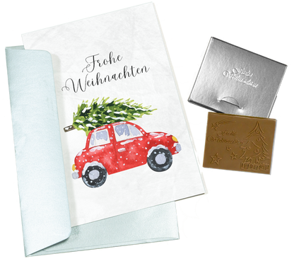 Weihnachtskarten mit Schokoladenprägung in Goldbox, 5er-Set, Kartendesign: dunkelblauer Himmel mit Weihnachtsbaum, Schokoladenprägung: „Frohe Weihnachten“, Umschlag in Gold